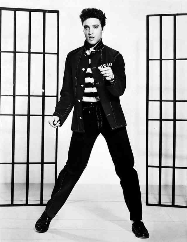 Which of Elvis Presley's songs became his first number-one hit on the Billboard charts in 1956?
