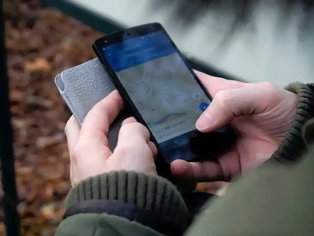Scrolling Through His Phone