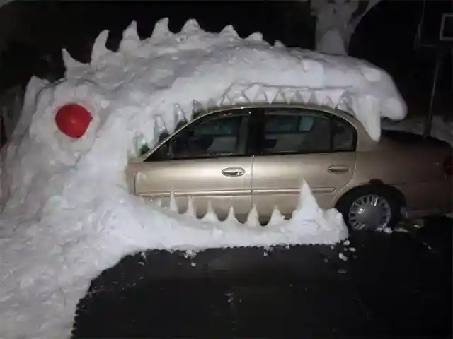 Snowy Dinosaur Eats Car