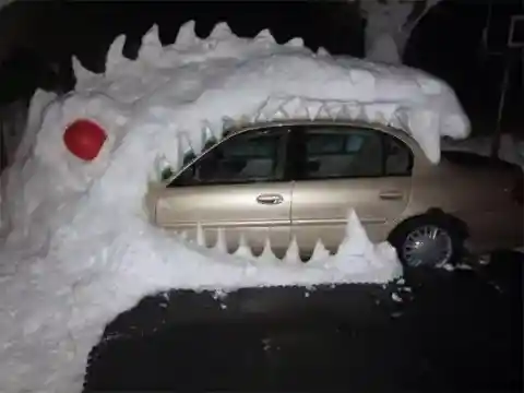 Snowy Dinosaur Eats Car