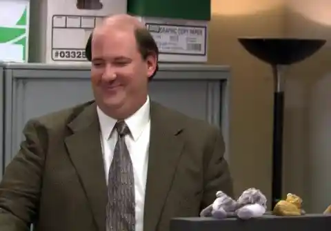 What did Kevin wear on his feet at Jim and Pam’s wedding? 